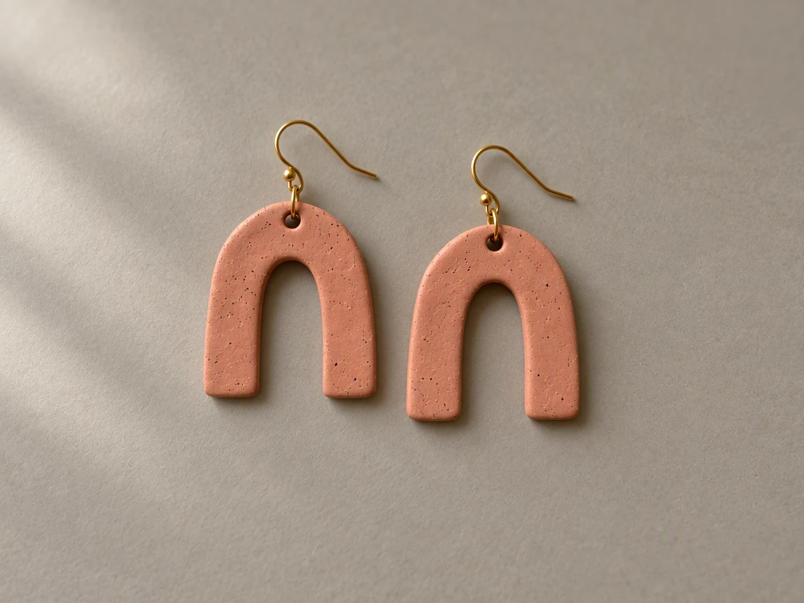 PicOnTap result: the same earrings on a warm gray matte surface